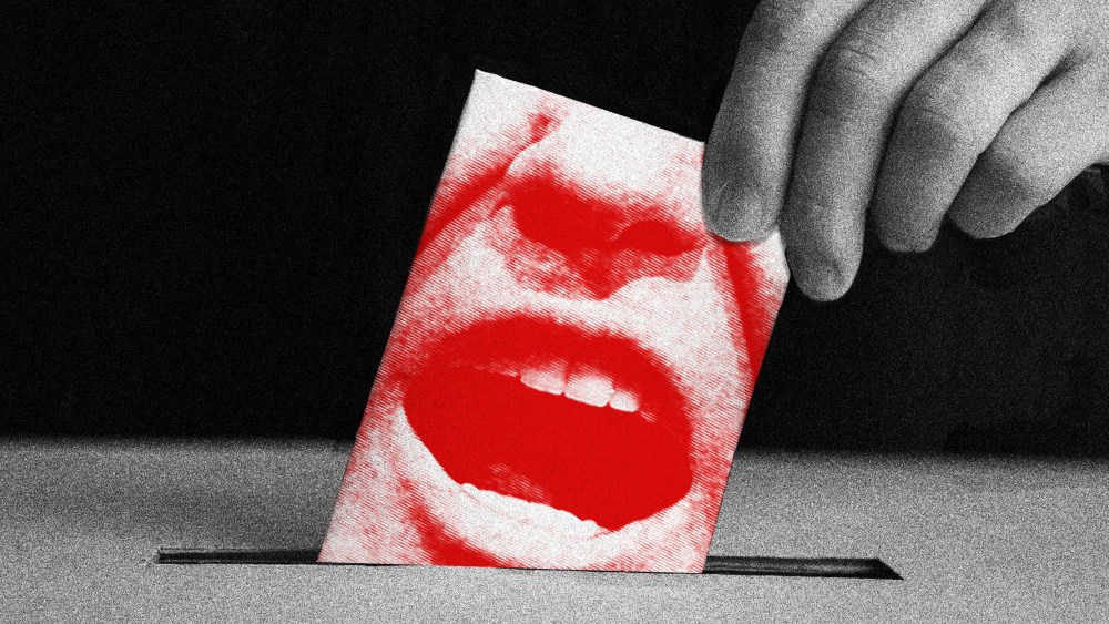 Image: A hand puts in a ballot which has a close up of Trump's screaming face into the ballot box