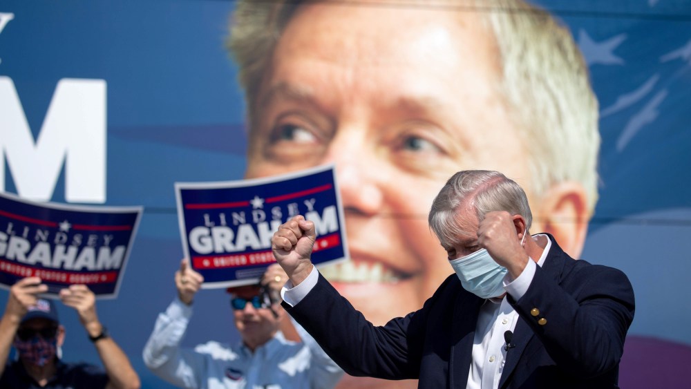 Image: Image: Sen. Lindsey Graham greets supporters in North Charleston, S.C., on Oct. 16, 2020.