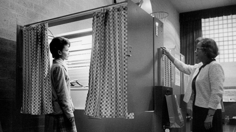 Image: A precinct official clears an automatic voting machine in Jamestown, N.Y., in 1965.
