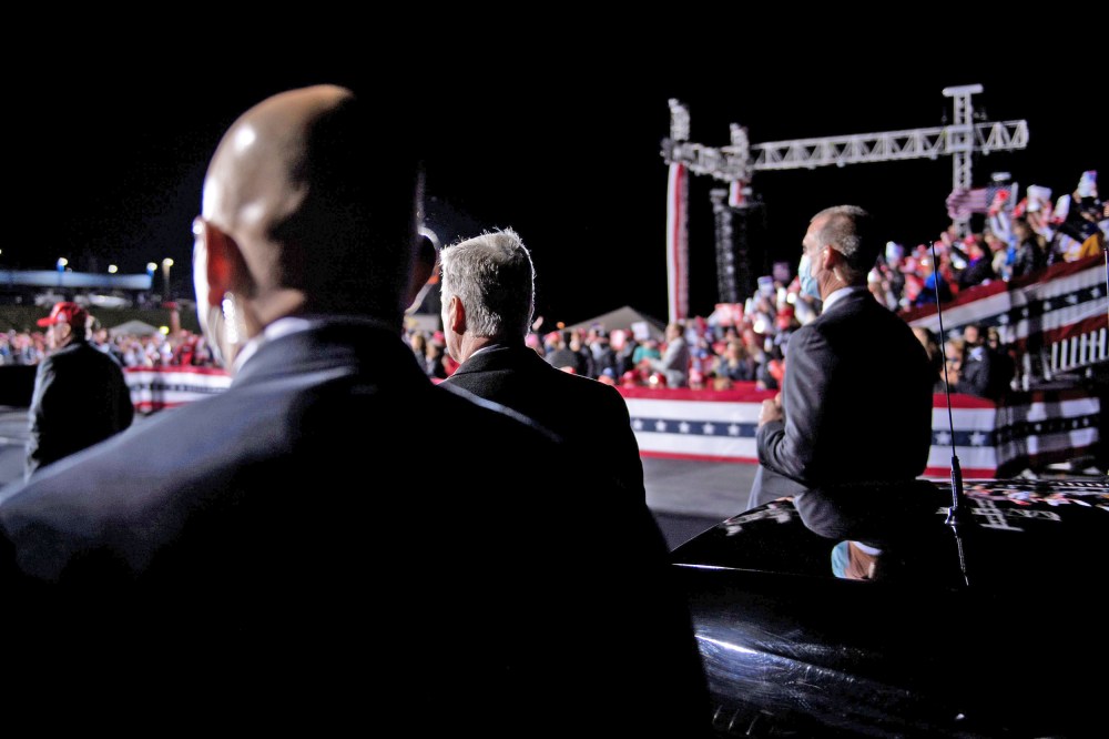 Secret Service members and others listen while President Donald Trump speaks in Hickory, N.C., on Nov. 1, 2020.