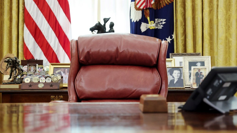 Image: President Trump's chair sits empty in the Oval Office at the White House in Washington