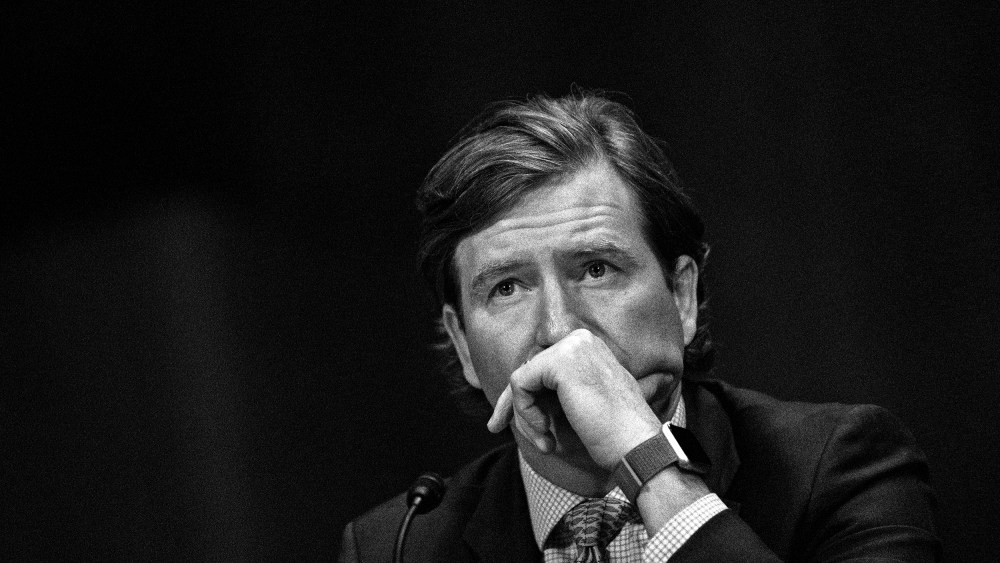 Image: Chris Krebs listening at a Senate Judicial Committee hearing
