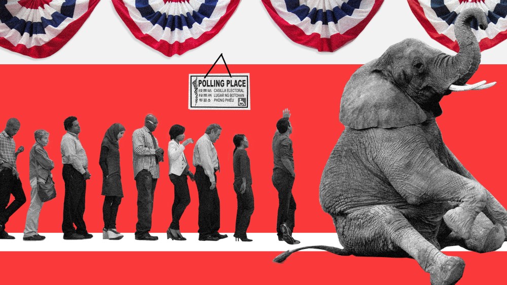 Image: An elephant sits and blocks a voting line