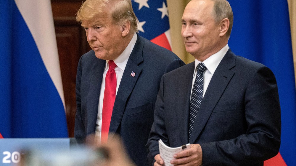 Image: President Donald Trump and Russian President Vladimir Putin arrive to waiting media during a joint press conference after their summit