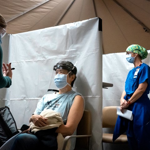 Image: Healthcare workers getting vaccinations in a calinic