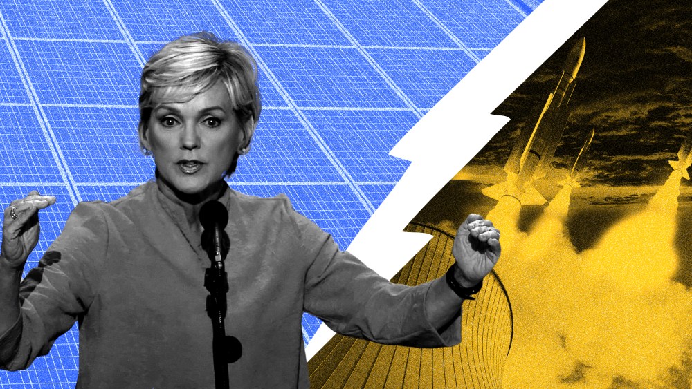 Image: Jennifer Granholm speaks in front of a divided background, one half has solar panels and the other has nuclear missiles.