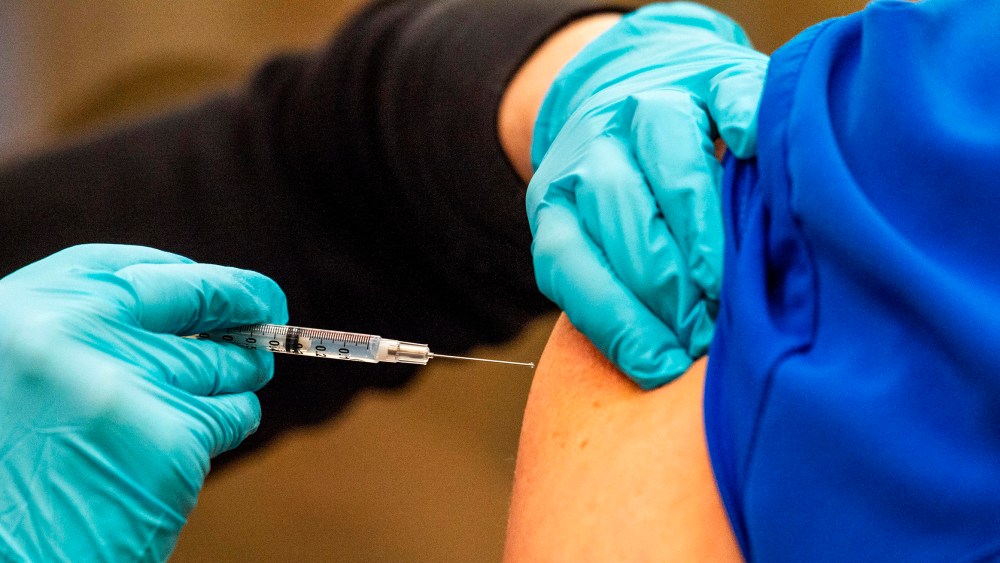 Image: A healthcare worker getting a vaccine