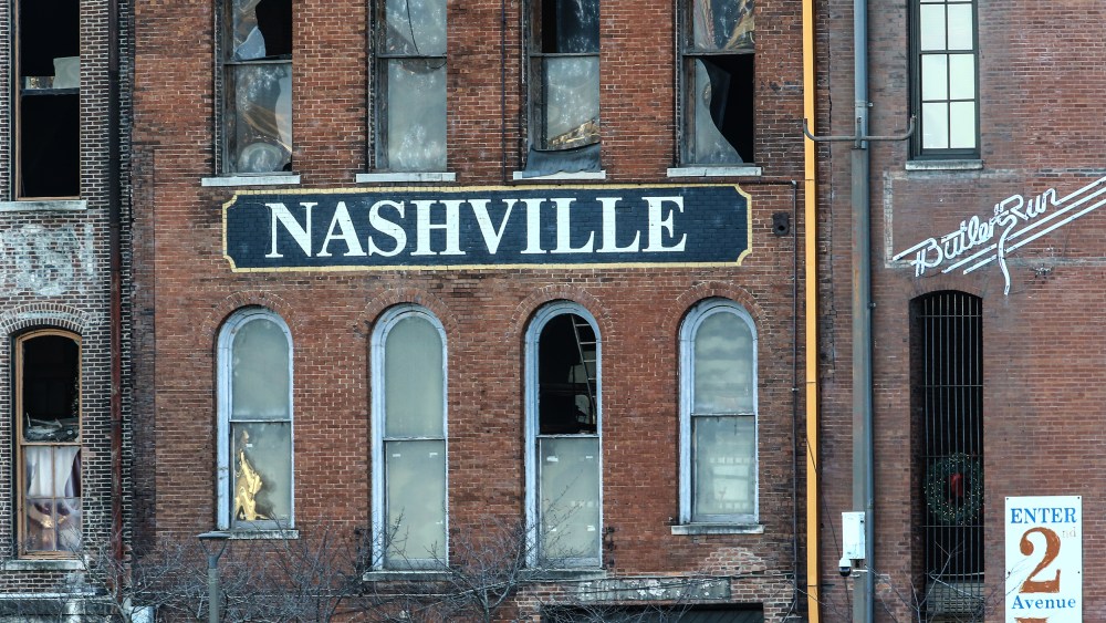 Image: A building in Nashville with broken glass windows after an explosion.