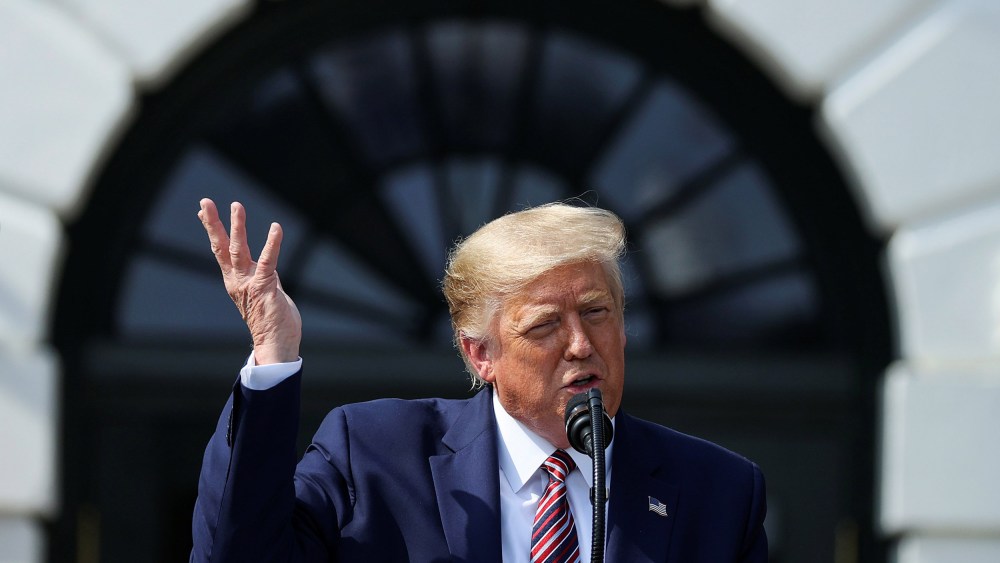 Image: President Donald Trump speaks about administration efforts to curb federal regulations during an event on the South Lawn of the White House