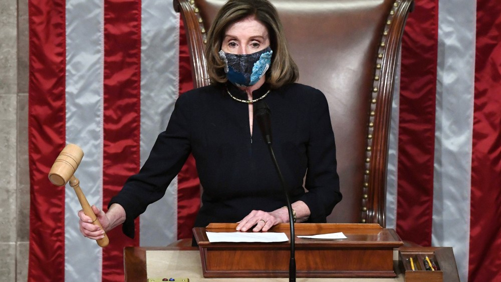 Image: House Speaker Nancy Pelosi gavels in the final vote of President Donald Trump's impeachment at the Capitol