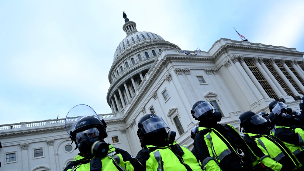 Image: Police stand guard as protesters gather near the Capitol on Jan. 6, 2021.