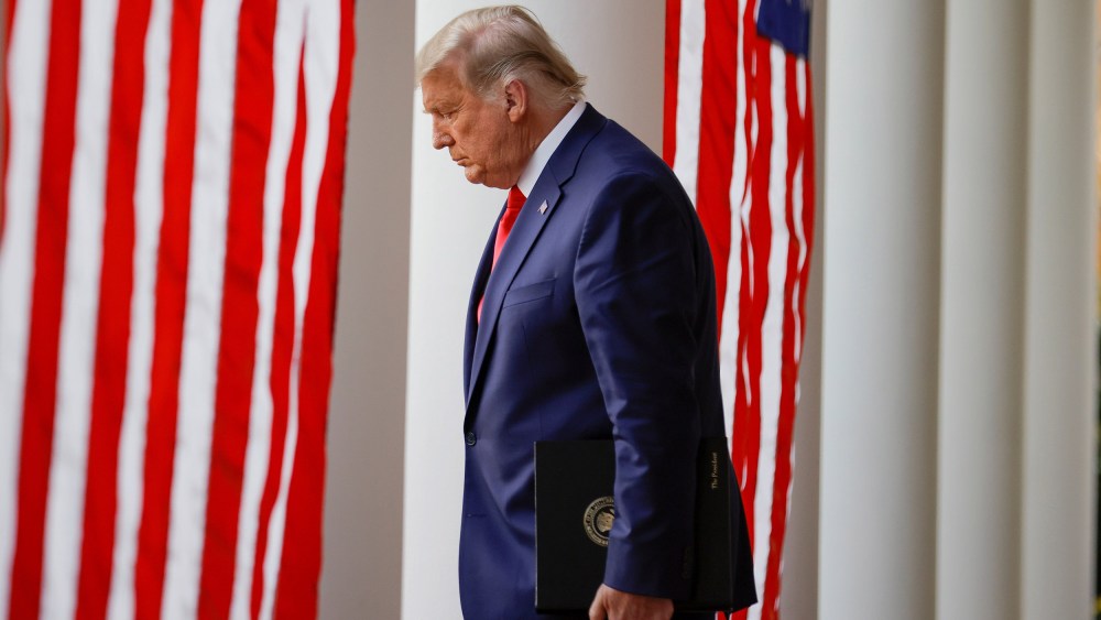 Image: President Donald Trump walks down the West Wing colonnade from the Oval Office to the Rose Garden.
