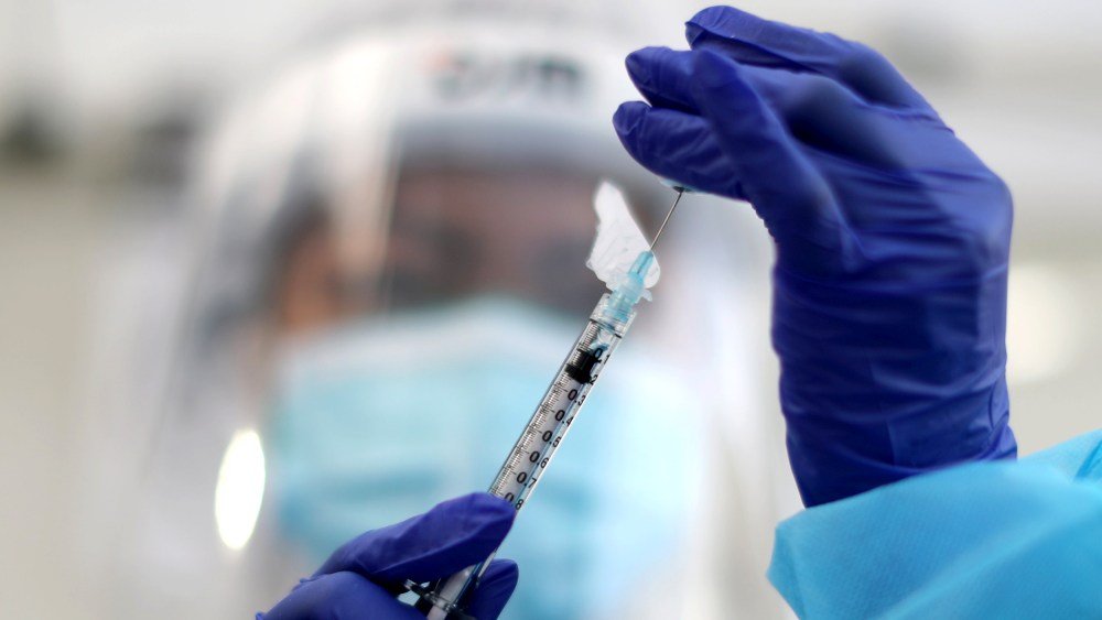 Image: A healthcare worker prepares a Pfizer coronavirus disease (COVID-19) vaccination in Los Angeles