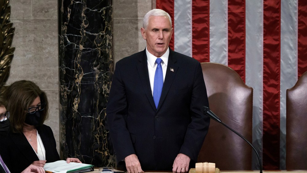 Image: Vice President Mike Pence reads the final certification of Electoral College votes cast in November's presidential election at the Capitol,