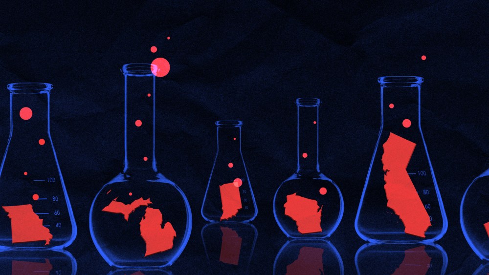 Photo illustration of blue glass flasks in a dark lab with one red U.S. state in each. Bubbles are coming out of each flask.