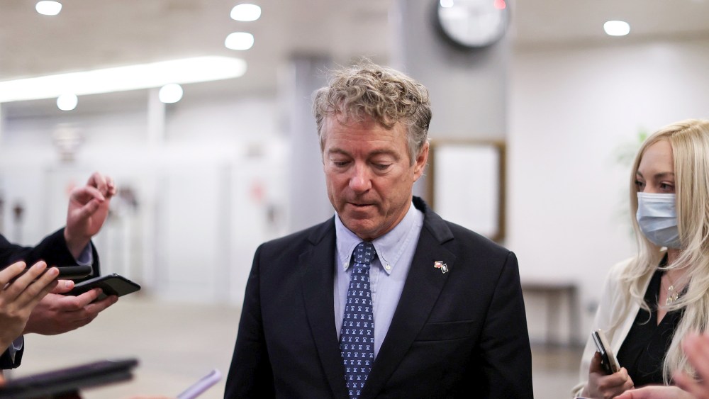 Image: U.S. Senator Paul is trailed by reporters as he arrives to be sworn in for the impeachment trial of former president Trump in the U.S. Capitol in Washington