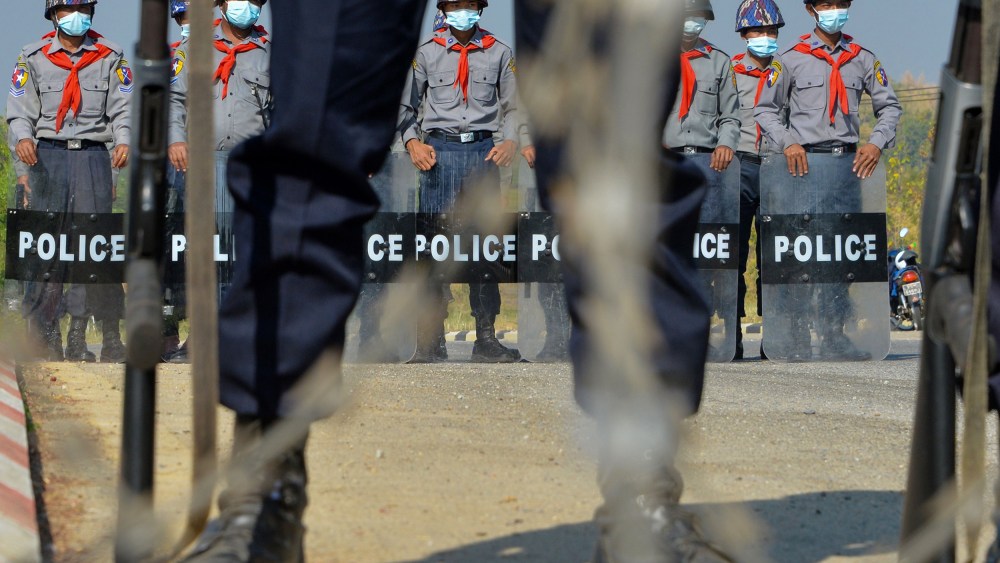 Image: Police wearing stand guard in Naypyidaw, Myanmar.