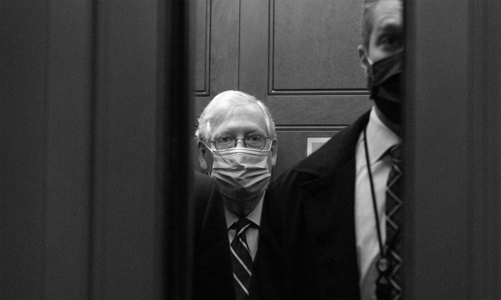 Image: Mitch McConnell boards an elevator after leaving the Senate floor.