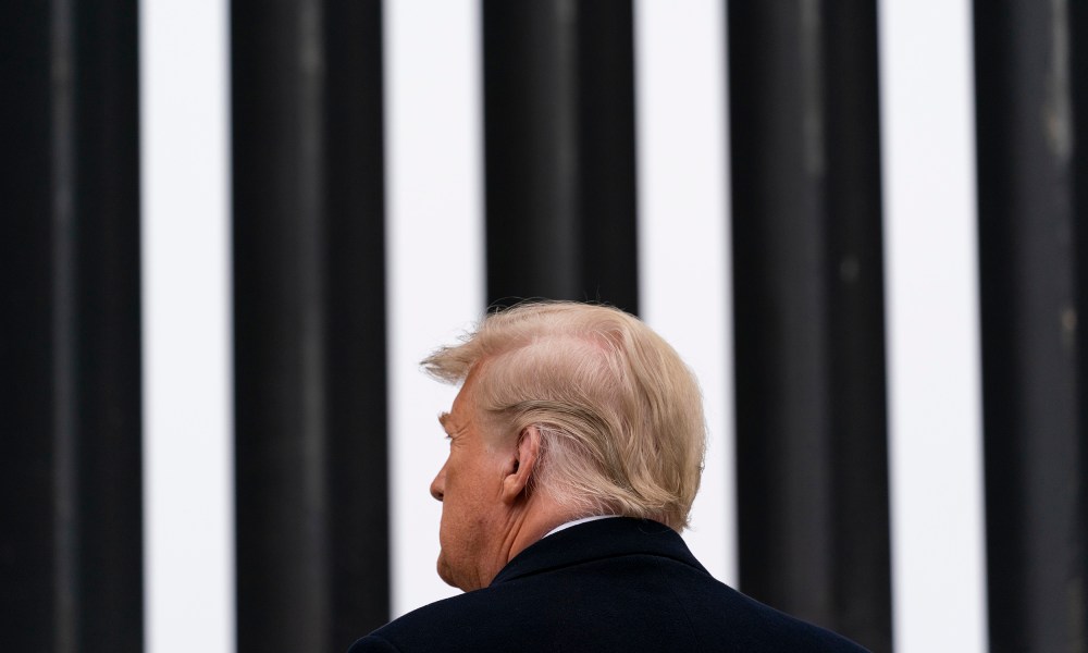 Image: Donald Trump looking at a section of the U.S.-Mexico border wall