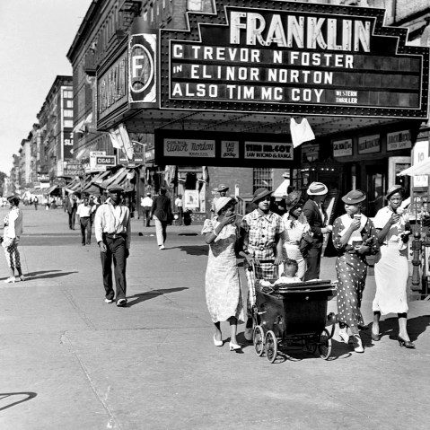 Image: Pedestrians on a summer day in Harlem, N.Y., in 1935.