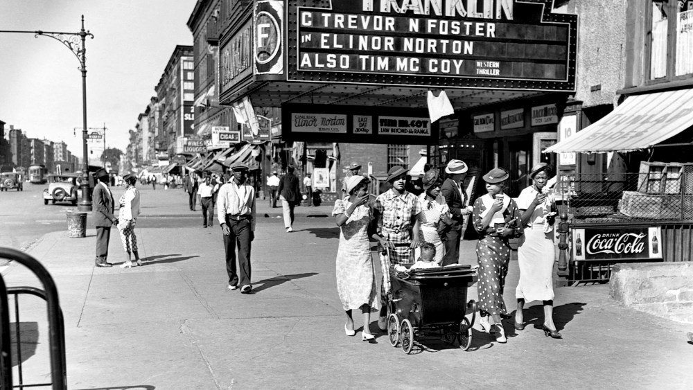 Image: Pedestrians on a summer day in Harlem, N.Y., in 1935.