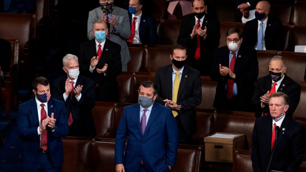 Image: Sen. Ted Cruz and Rep. Paul Gosar are being applauded by Republican colleagues around them.
