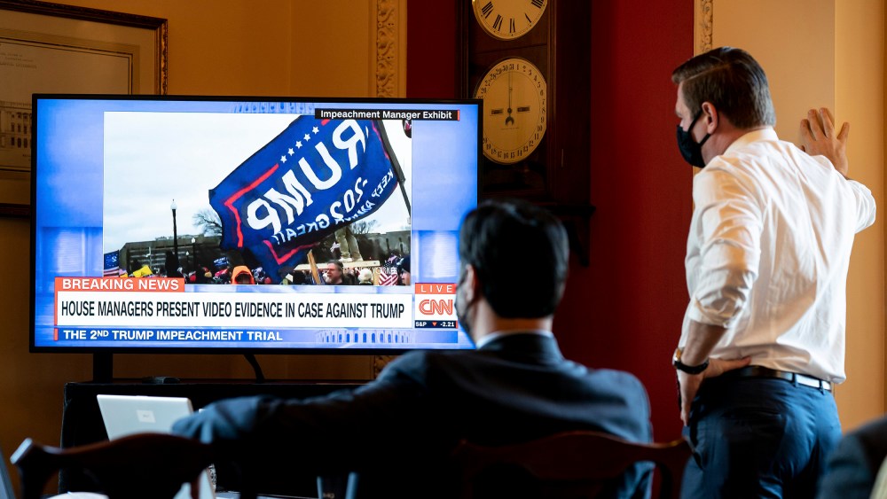 Image: House impeachment managers watch the first day of proceedings in the Senate trial of former President Donald Trump from a room in the Capitol in Washington