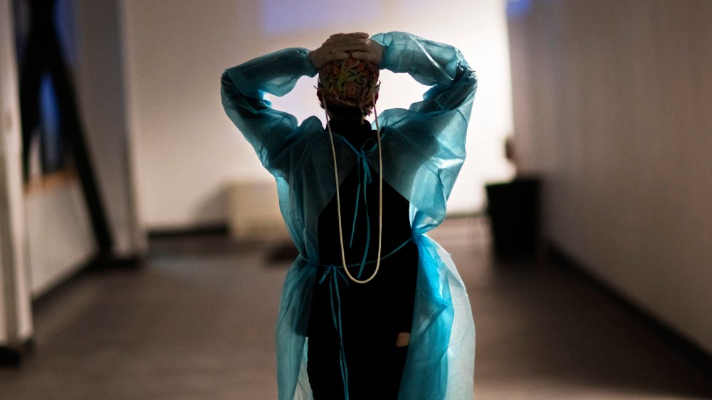 Image: A nurse walks down the hallway of a hospital