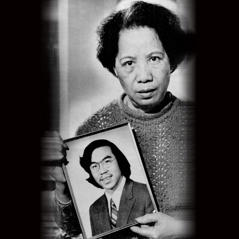 Image: Lily Chin holds a photograph of her son Vincent Chin.