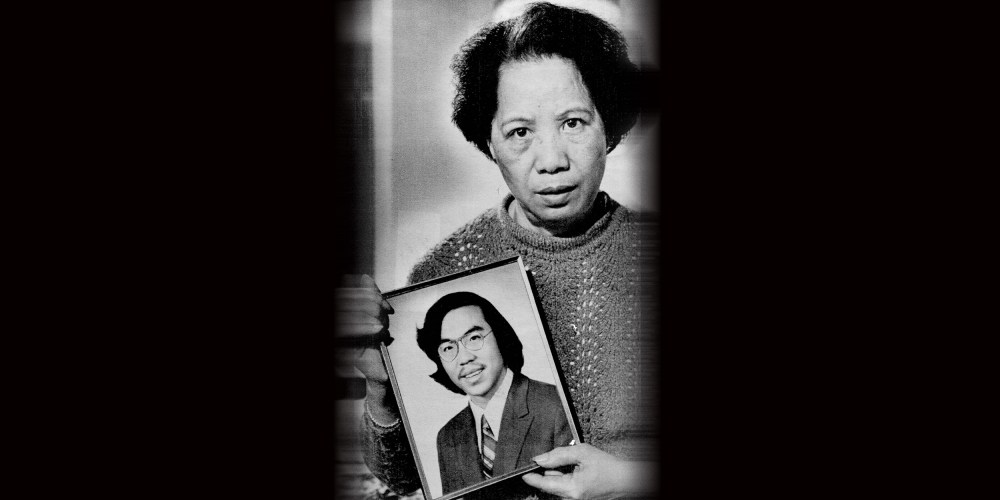 Image: Lily Chin holds a photograph of her son Vincent Chin.