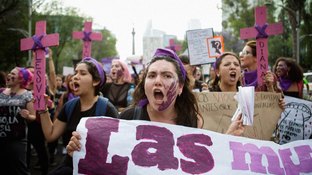 Image: Demonstrators with signs and crosses for the victims of femicide attend a national strike on International Women's Day in Mexico City on March 8, 2018.