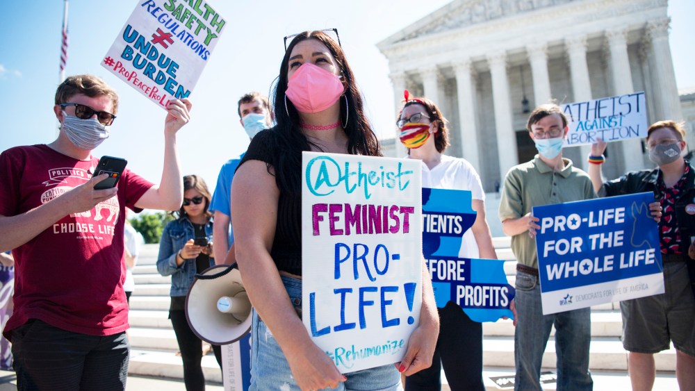 Anti-abortion demonstrators protest in front of the Supreme Court on June 29, 2020.
