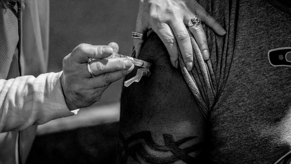 Image: A patient receives a Covid-19 vaccine in Federal Way, Wash., on Feb. 4, 2021.