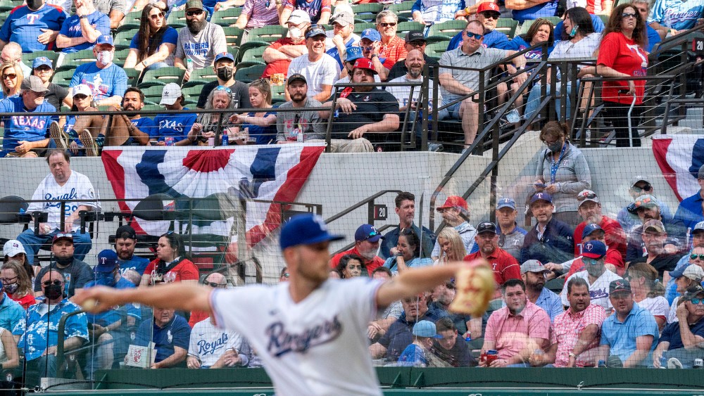 Image: Texas Rangers fans watch relief pitcher Kyle Cody work against the Toronto Blue Jays during the seventh inning of a game April 5, 2021, in Arlington, Texas.