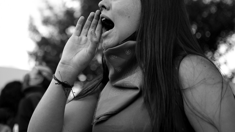 Image: Close-up for a woman at a protest.