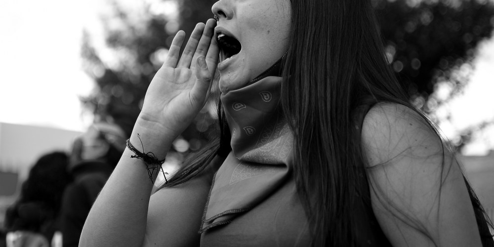 Image: Close-up for a woman at a protest.