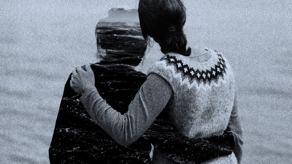 Photo illustration: A daughter holds onto the silhouette of her mother as they look into the ocean.