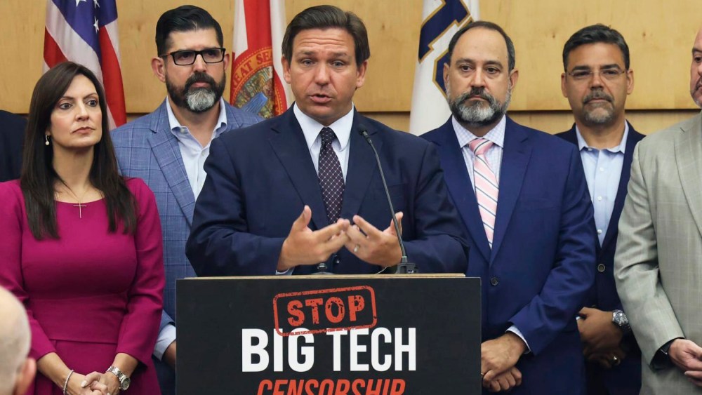 Gov. Ron DeSantis signed legislation Monday that seeks to punish social media platforms that remove political candidates from their sites.