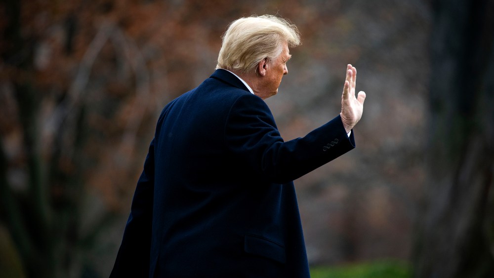 Image: Donald Trump waves as he departs on the South Lawn of the White House.