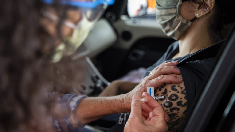 Healthcare Workers Administer Covid-19 Vaccines At Airport As U.S. Daily Cases Hit 14-Month Low