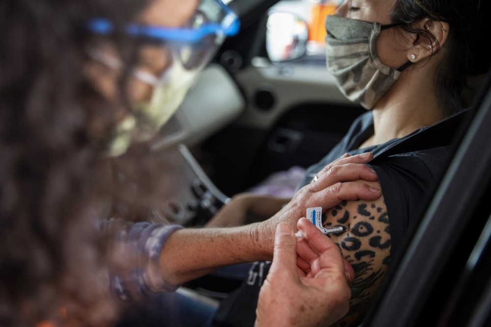 Healthcare Workers Administer Covid-19 Vaccines At Airport As U.S. Daily Cases Hit 14-Month Low