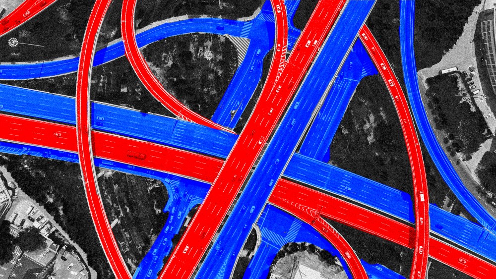 Photo illustration: Aerial view of red and blue colored highways crossing over each other.