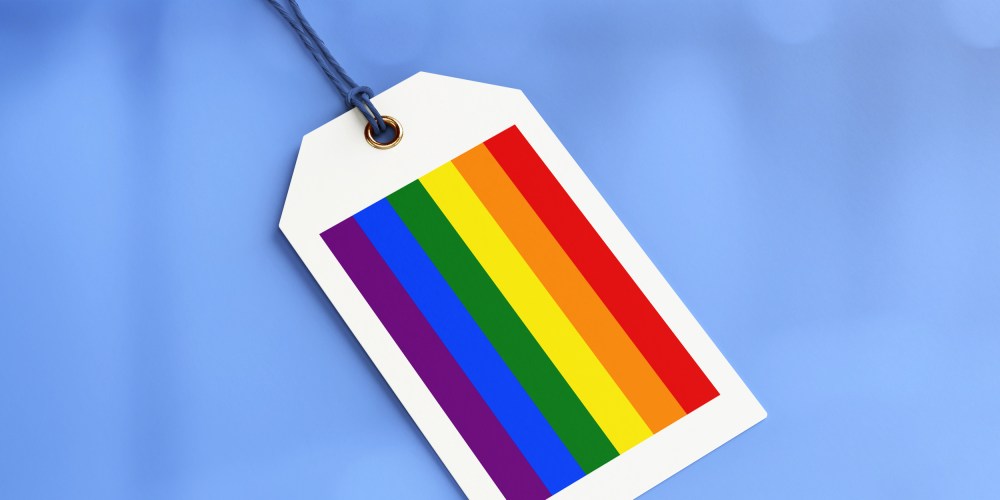 Photo illustration: A shopping tag with the pride flag colors.