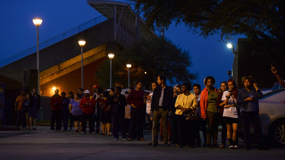 Image: Voters wait in line to cast their ballot.