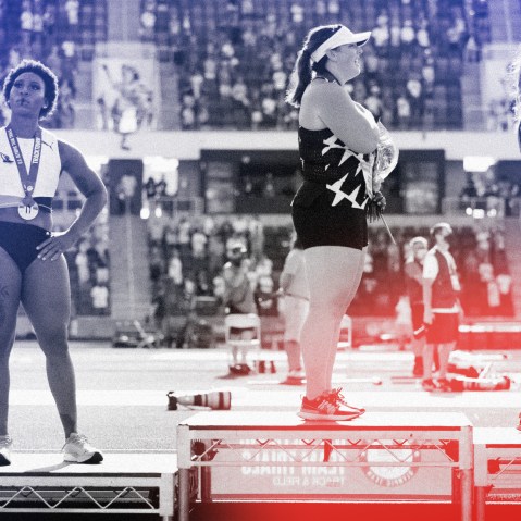 Image: Gwendolyn Berry, left, looks on during the playing of the National Anthem after the Women's Hammer Throw final at the U.S. Olympic Track and Field Team Trials in Eugene, Ore., on June 26, 2021.
