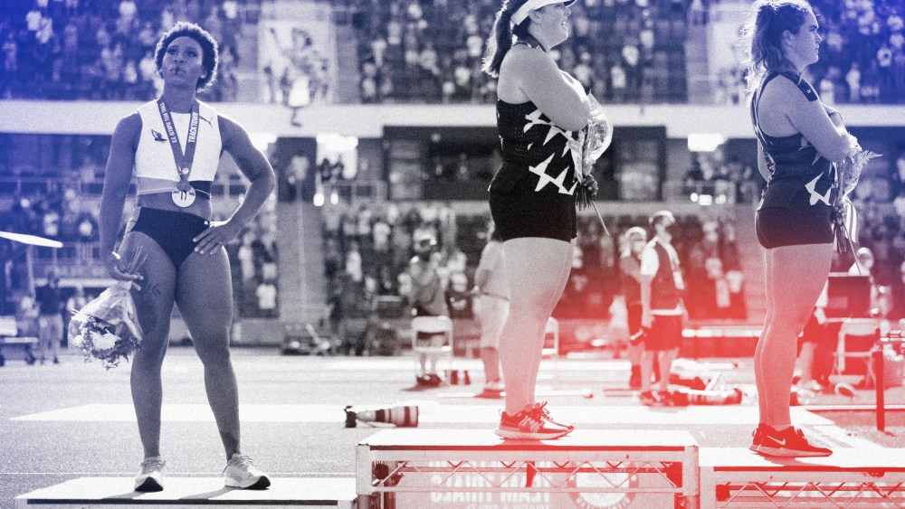Image: Gwendolyn Berry, left, looks on during the playing of the National Anthem after the Women's Hammer Throw final at the U.S. Olympic Track and Field Team Trials in Eugene, Ore., on June 26, 2021.