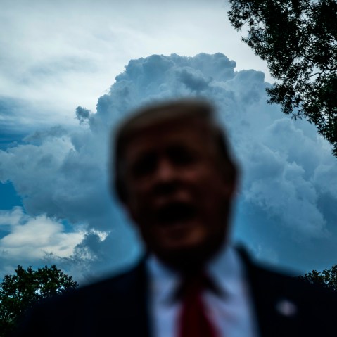 IMage: Then-President Donald Trump speaks to the media on the South Lawn of the White House in 2019.