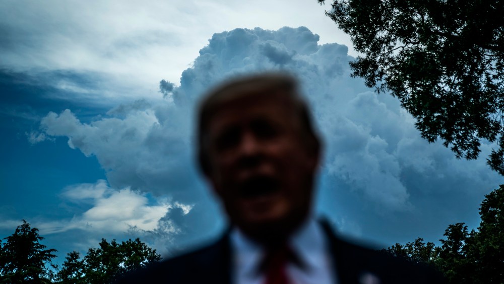 IMage: Then-President Donald Trump speaks to the media on the South Lawn of the White House in 2019.