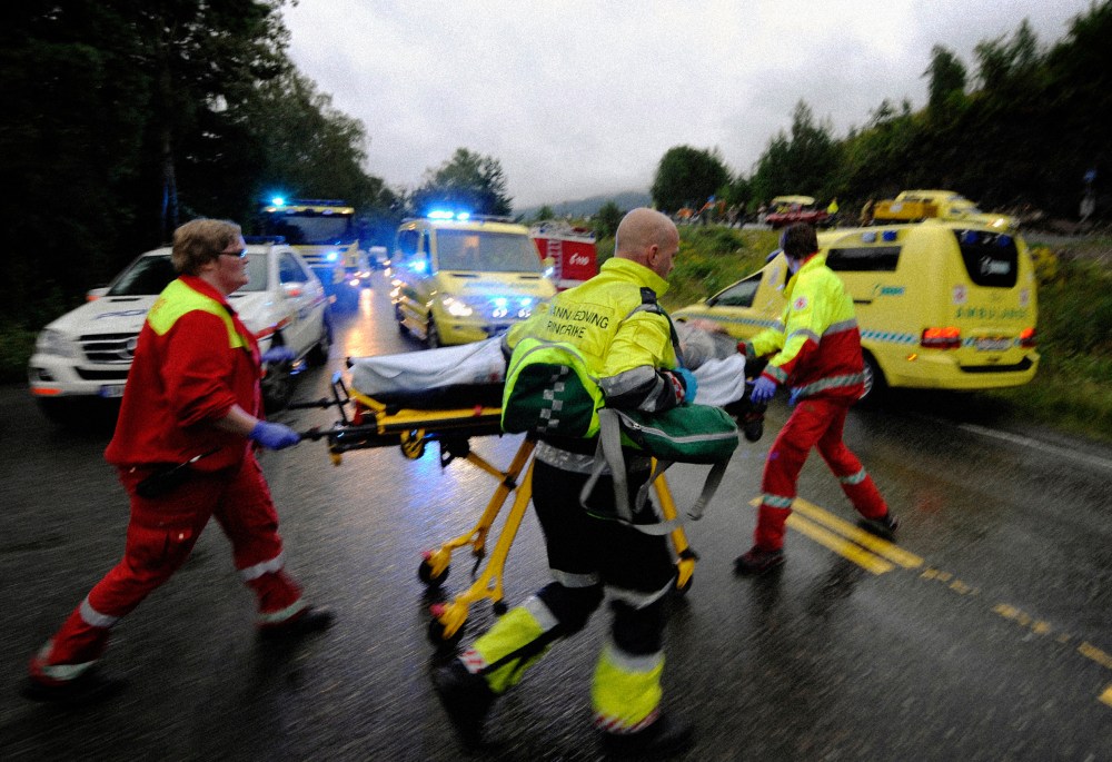 Image: Rescue workers evacuate a wounded person after a shooting on the Norwegian island of Utoya on July 23, 2011.