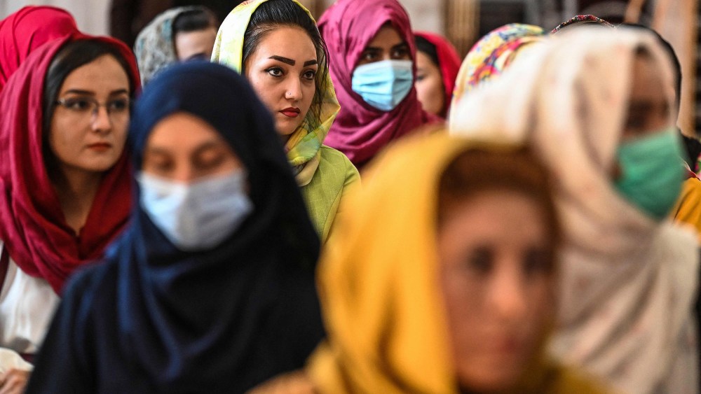 Image: Afghan women take part in a gathering at a hall in Kabul on Aug. 2, 2021 against the claimed human rights violations on women by the Taliban regime in Afghanistan.
